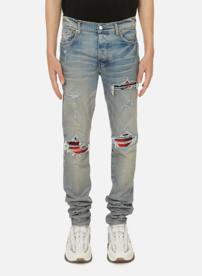 Jeans with frayed details  AMIRI