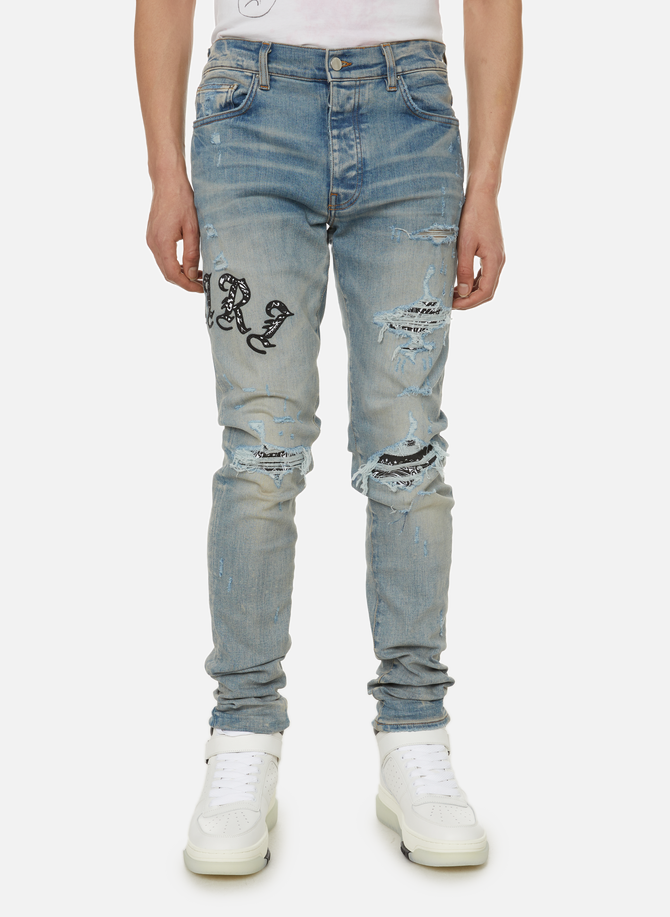 Distressed-effect denim jeans  AMIRI