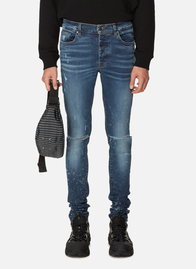 Skinny jeans with distressed effect AMIRI