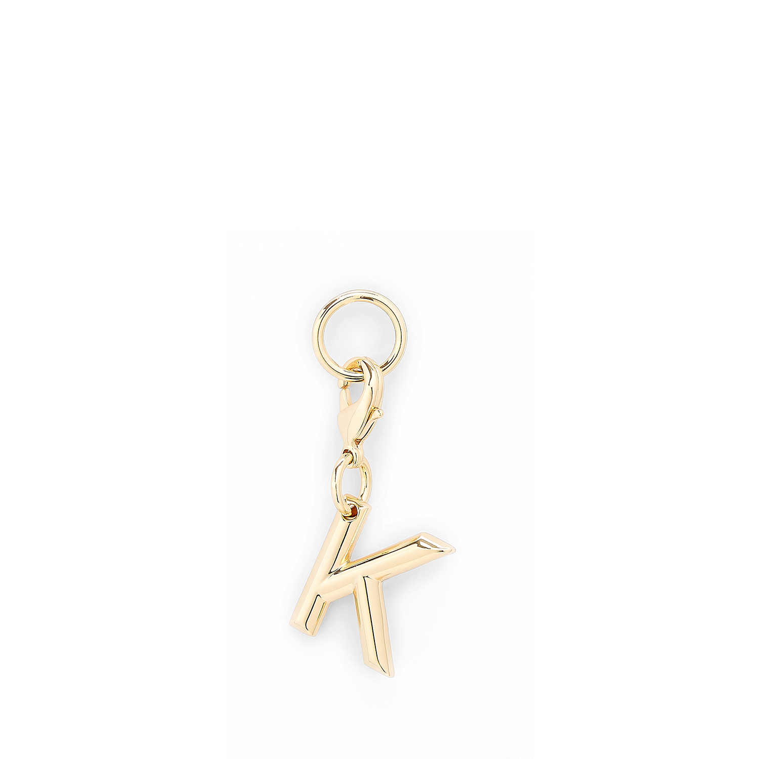 Lancel-bedeltje in de vorm van de letter K, goudkleurig metaal, gepolijste afwerking. LANCEL Goud