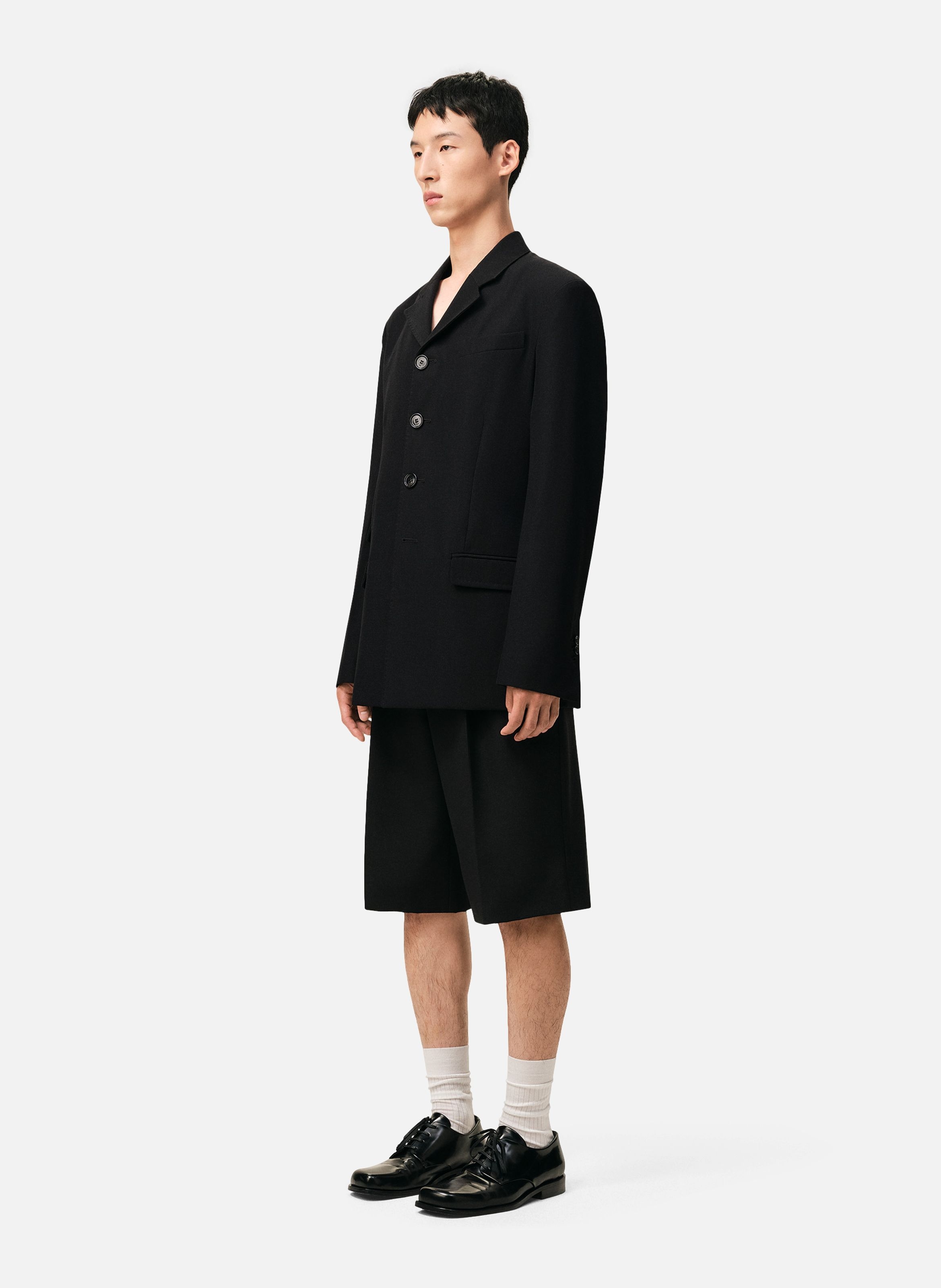 Veste droite simple boutonnage en laine vierge AMI PARIS Noir