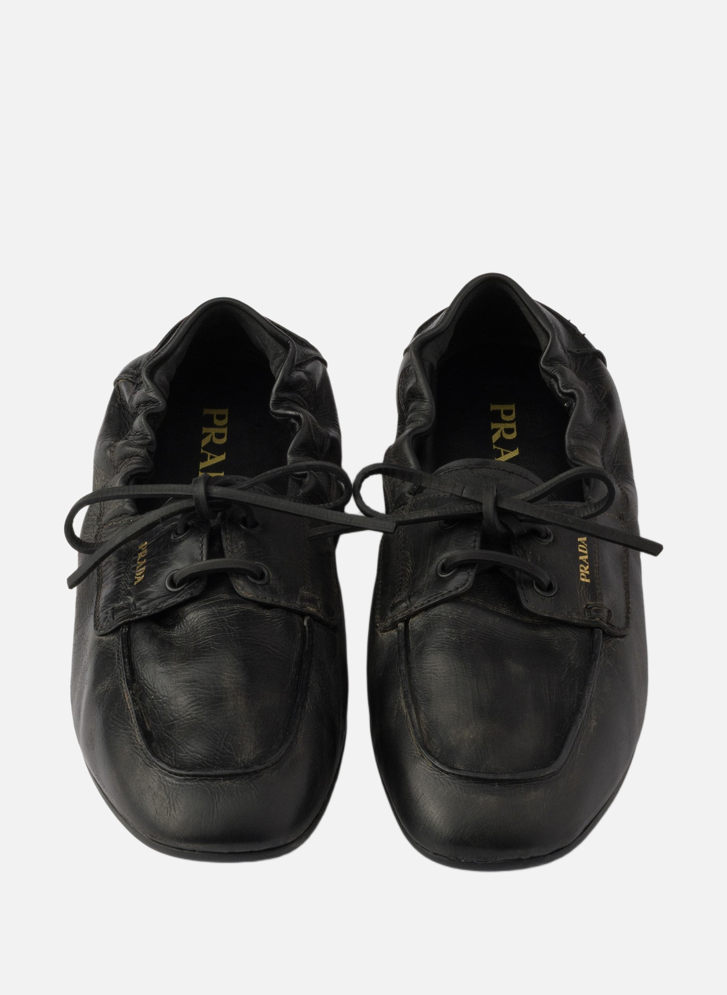 Chaussures bateau en cuir vieilli PRADA Noir