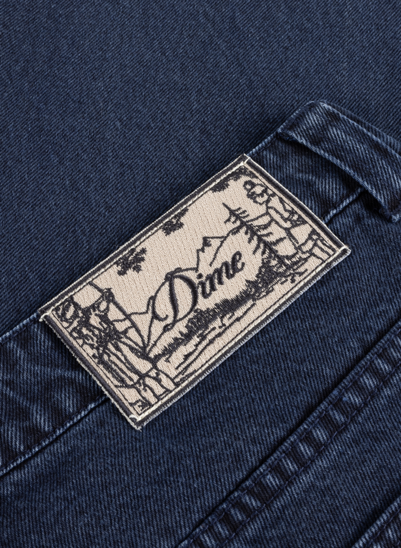 Jean à écusson brodé à la ceinture en coton DIME Blue
