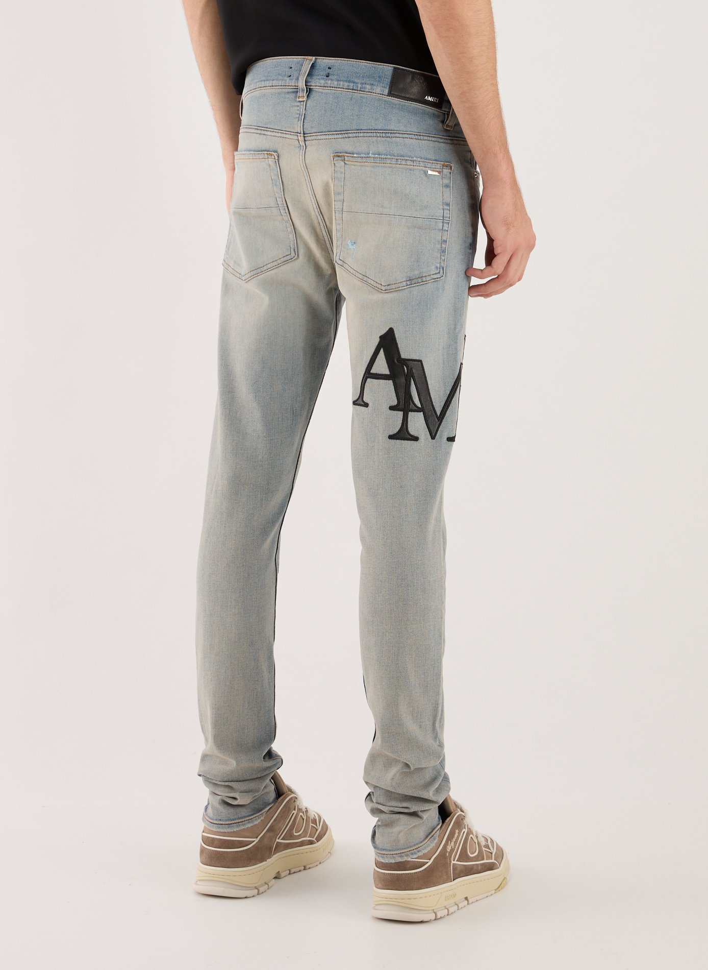 Slim washed jeans with logos Blue