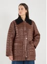 Veste longue matelassée  | Marron by GANNI GANNI Veste longue matelassée  | Marron