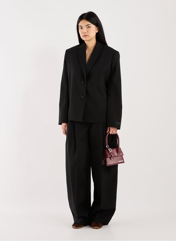 Pantalon ample en coton mélangé | Noir by JACQUEMUS Pantalon ample en coton mélangé Noir