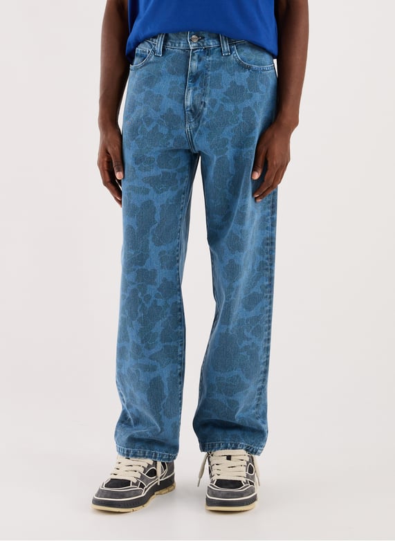 Jean imprimé fleuri en coton | Bleu by CARHARTT WIP Jean imprimé fleuri en coton Bleu