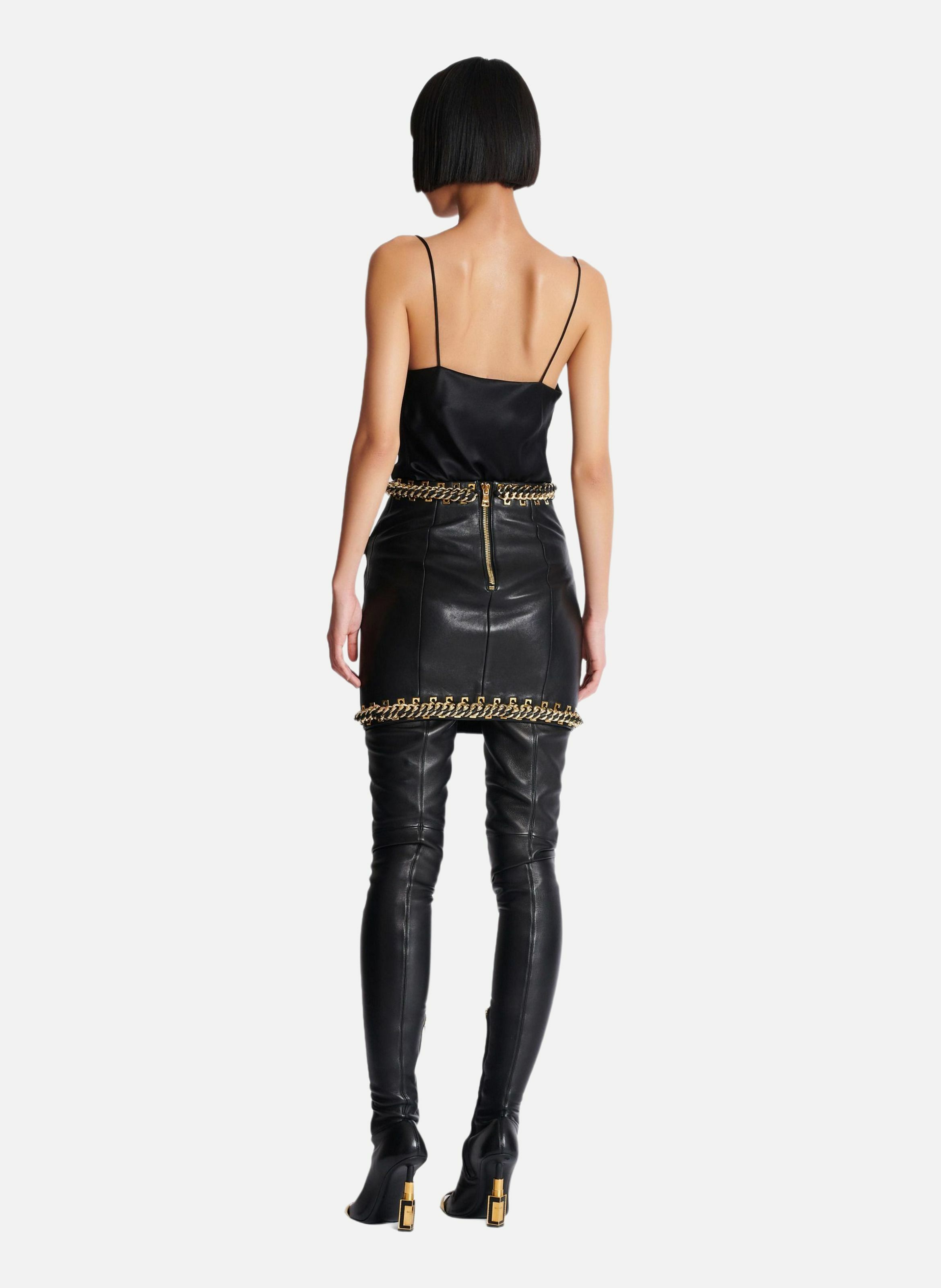 Jupe courte en cuir d'agneau avec chaînes BALMAIN Noir