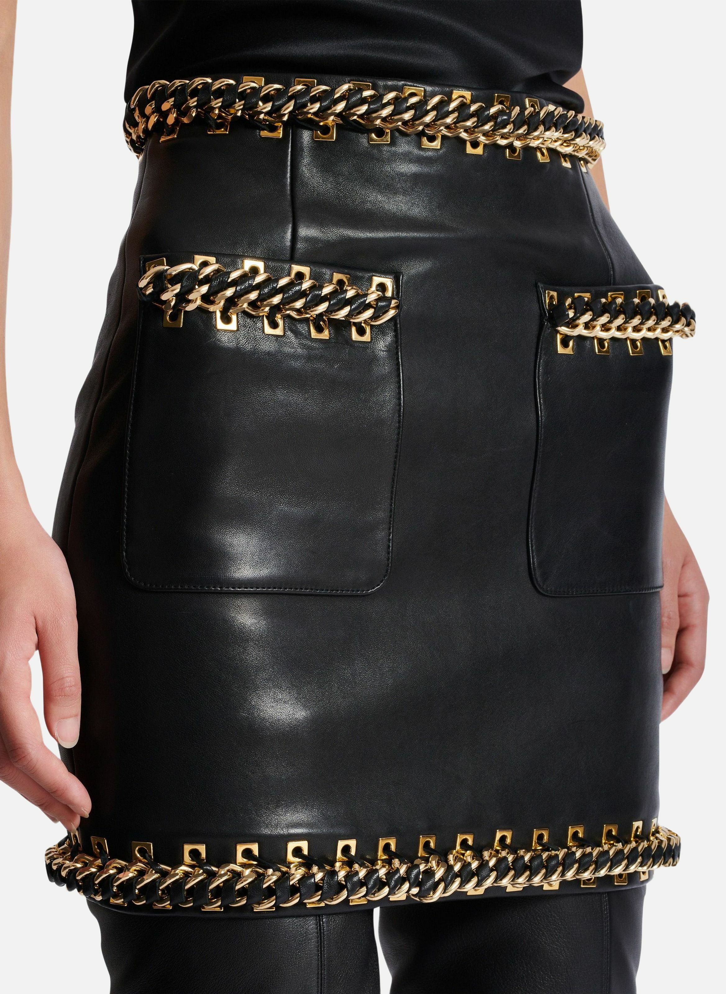 Jupe courte en cuir d'agneau avec chaînes BALMAIN Noir