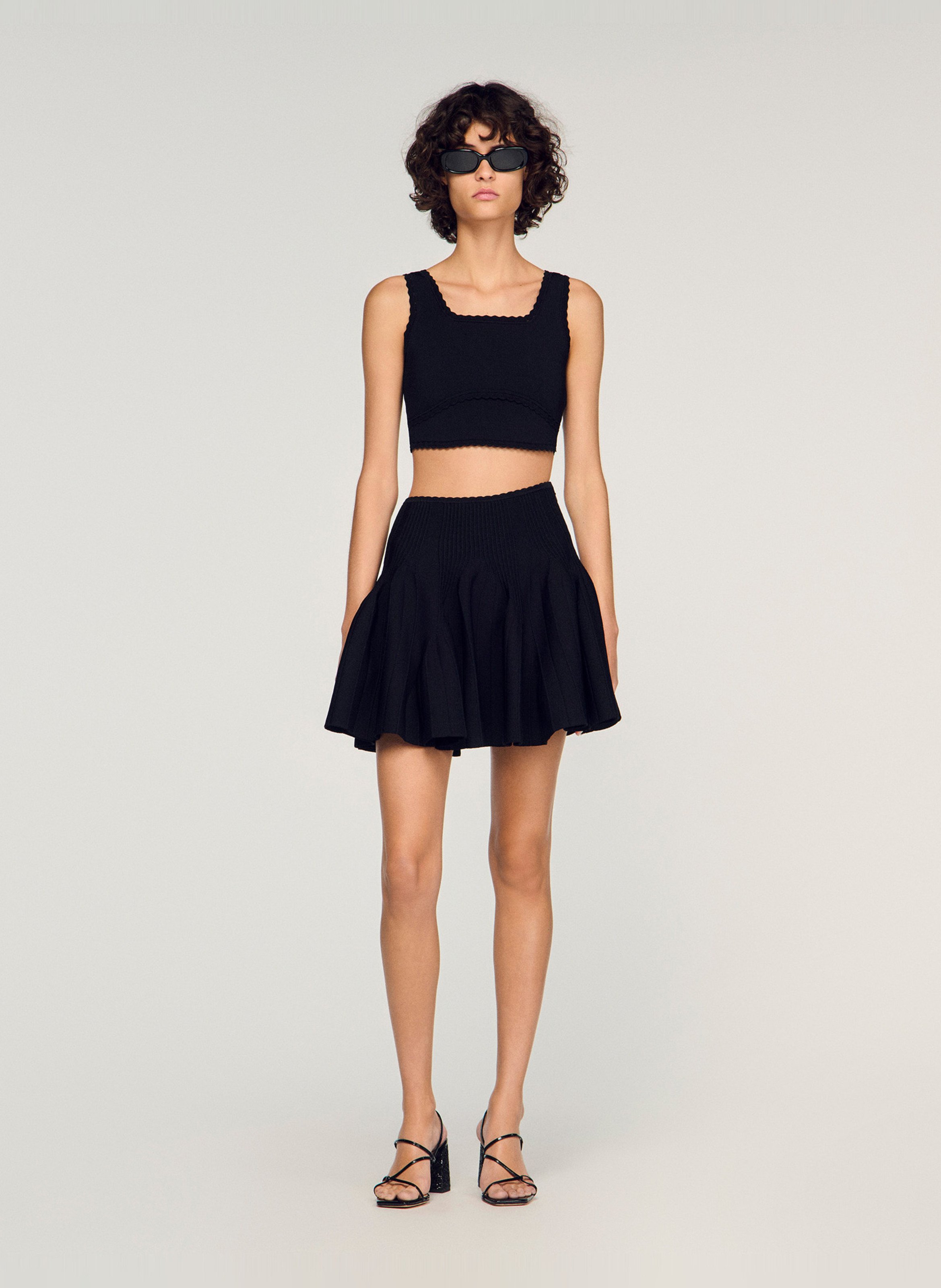 Jupe courte évasée en maille SANDRO Noir
