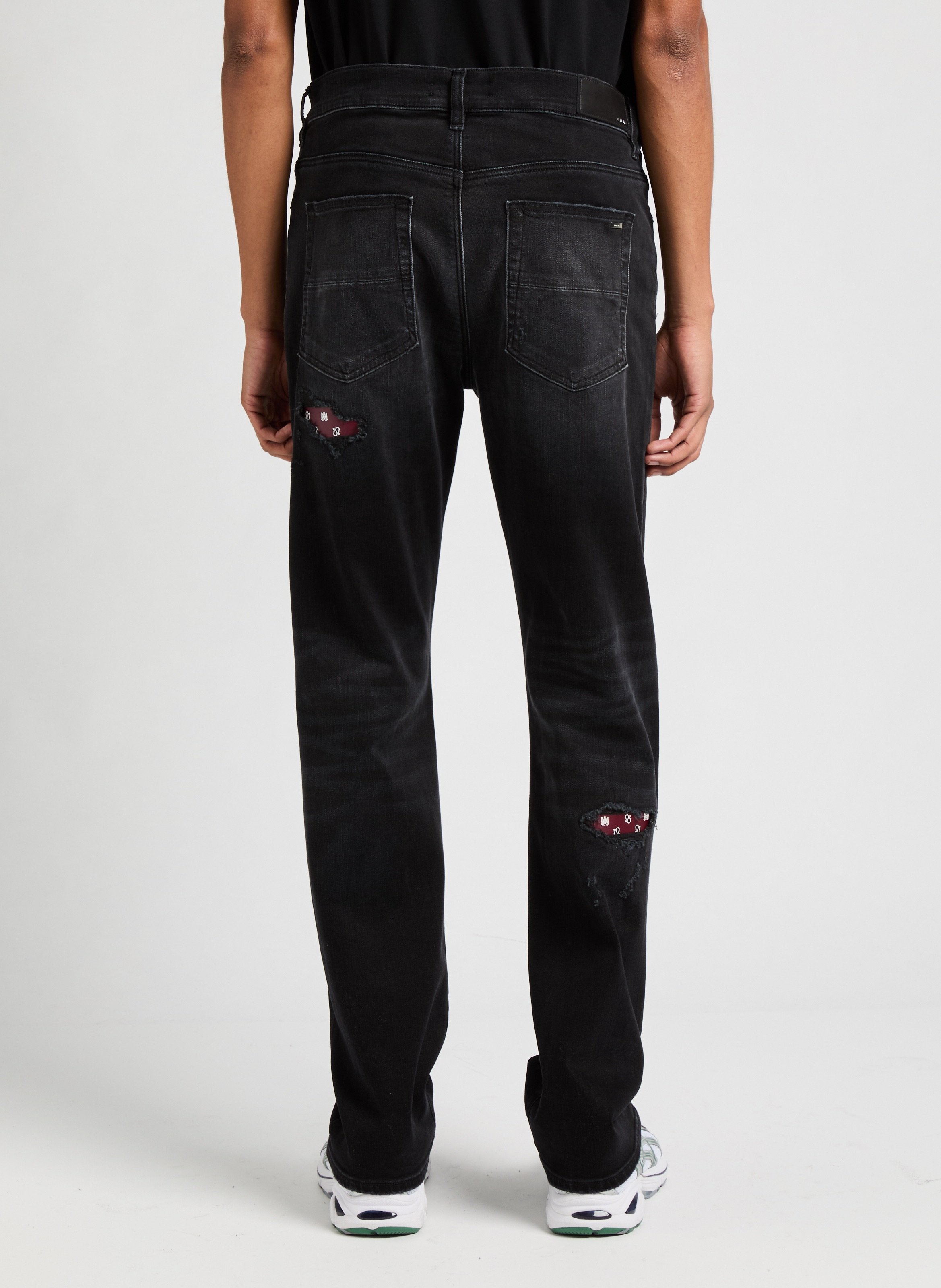 Ripped jeans with paisley patches AMIRI Black