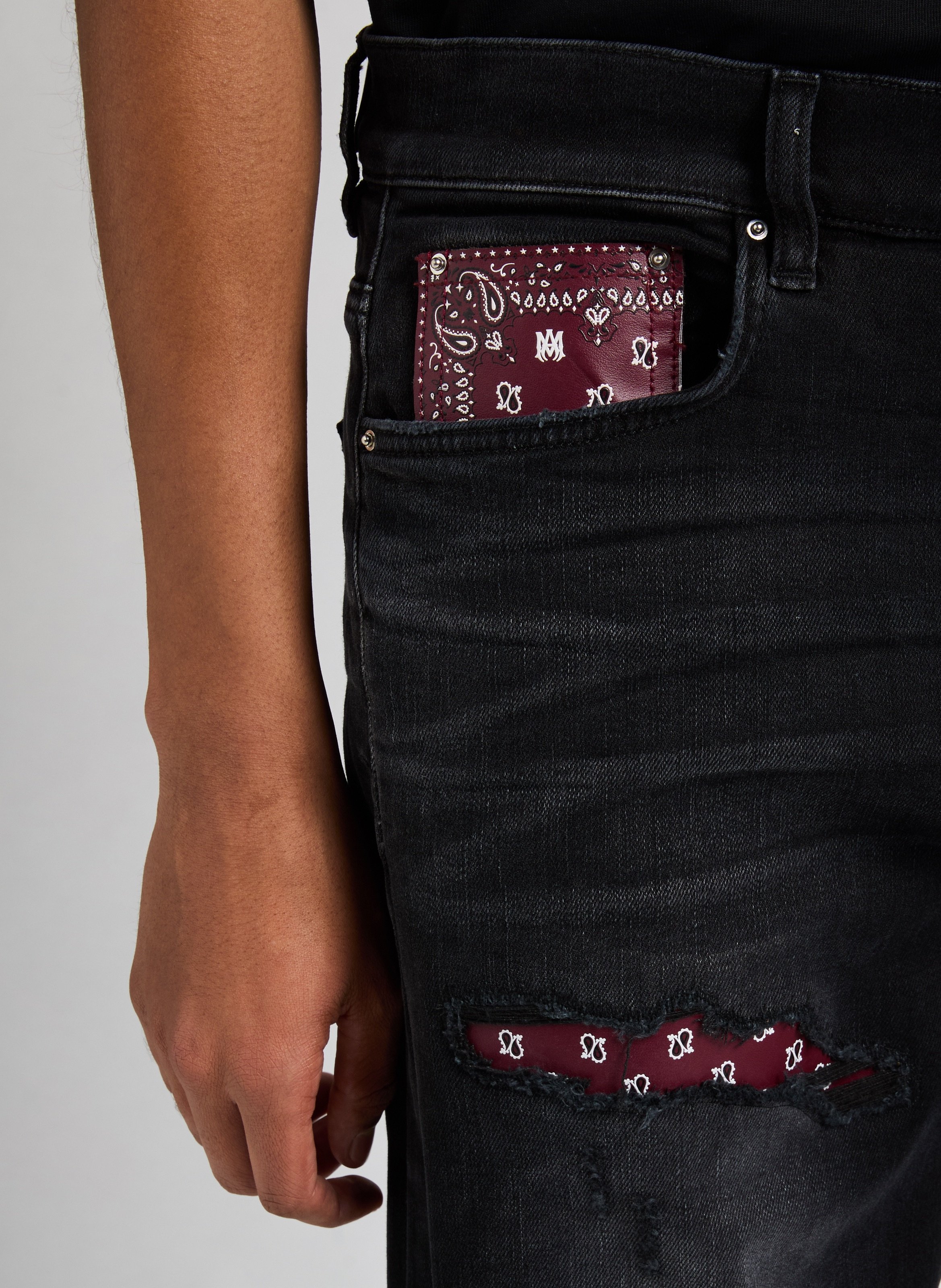 Ripped jeans with paisley patches AMIRI Black