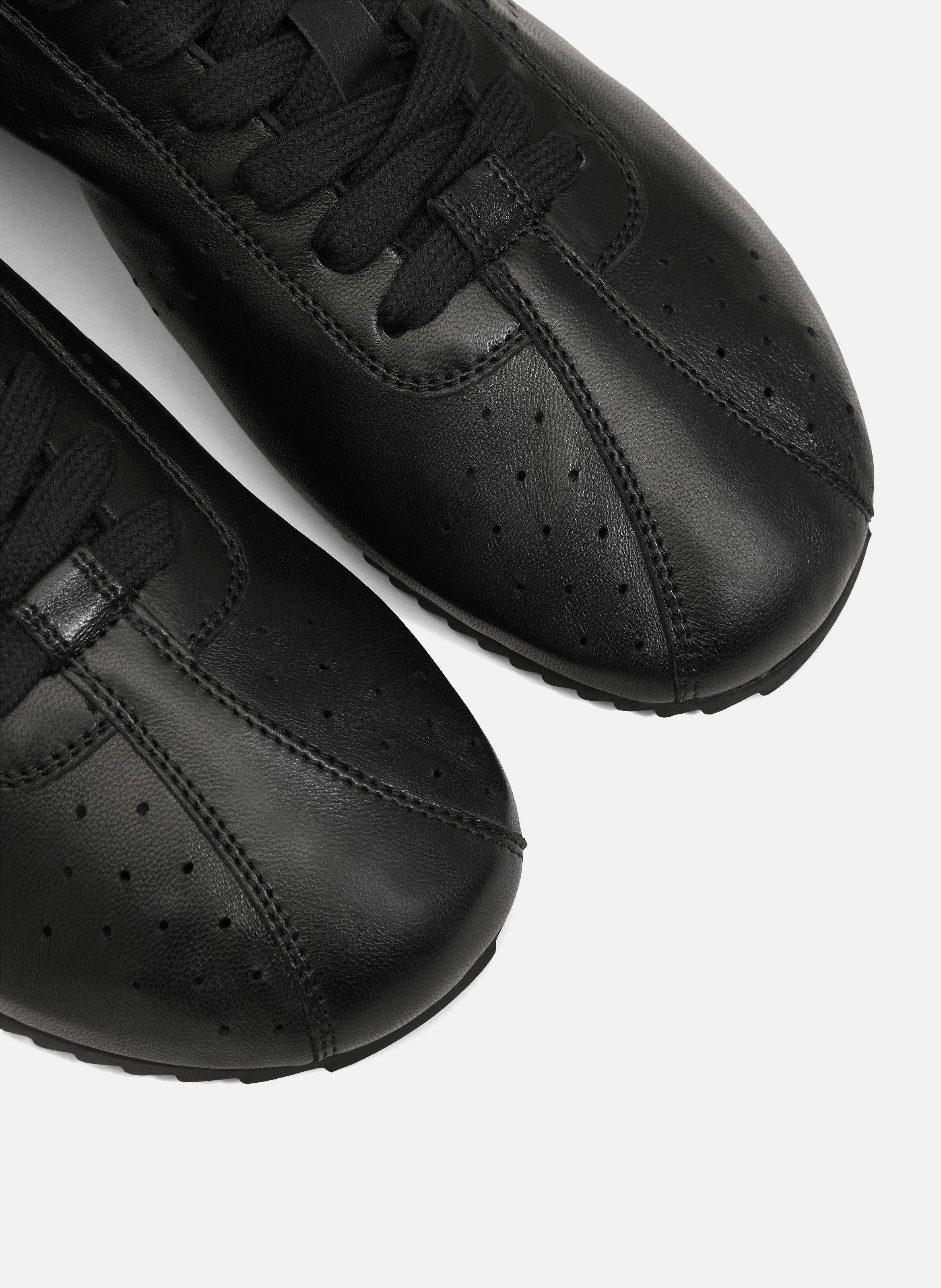 Baskets soft basses en cuir lisse unisexes AMI PARIS Noir