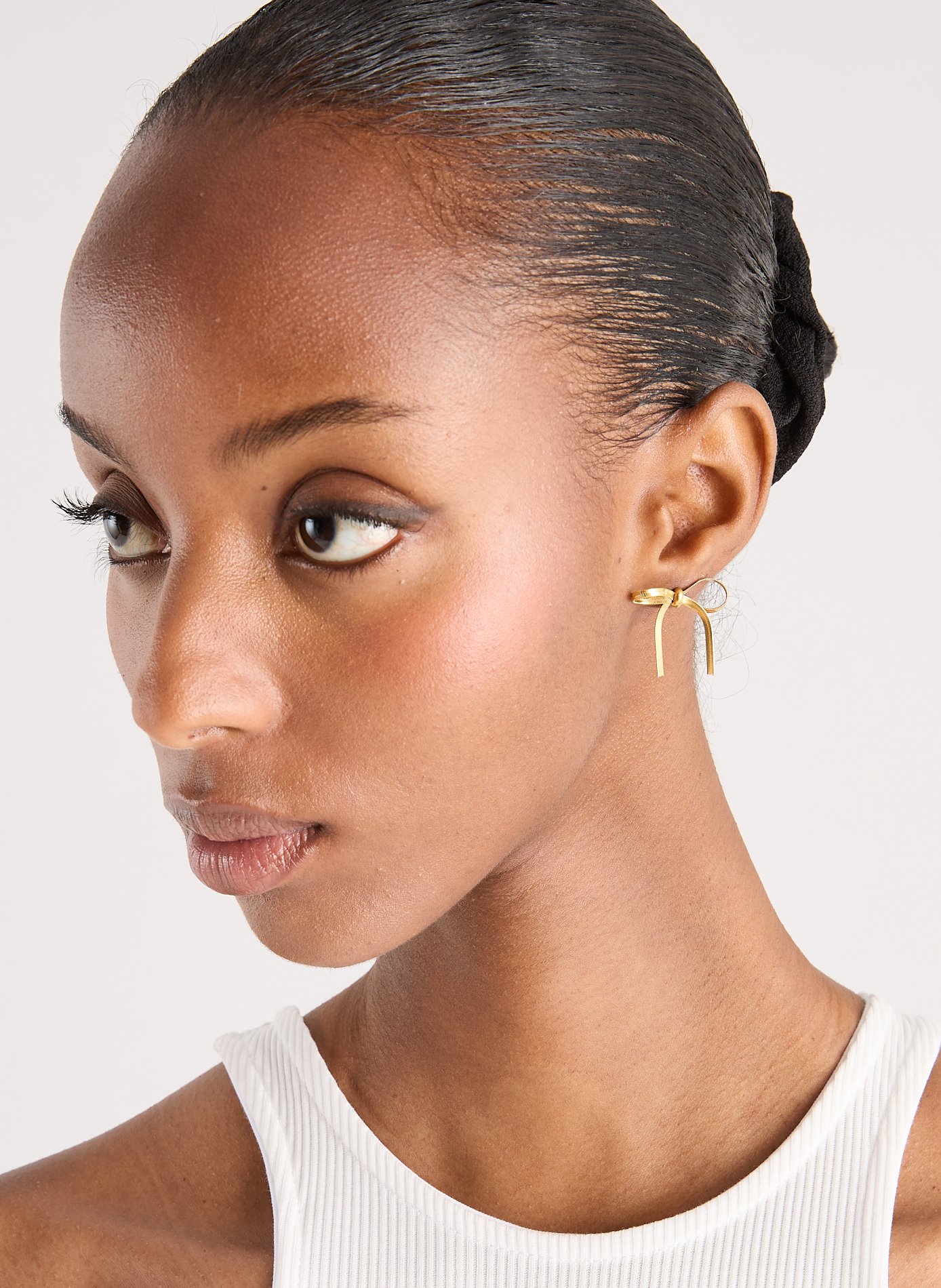 Boucles d'oreille noeud  AU PRINTEMPS PARIS Doré