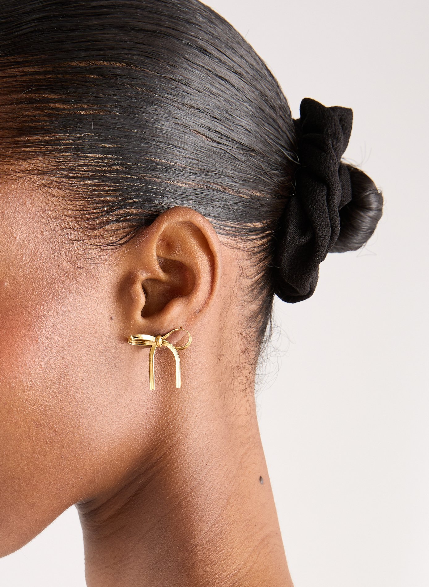 Boucles d'oreille noeud  AU PRINTEMPS PARIS Doré