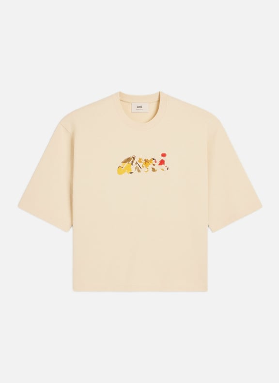 T-shirt en coton avec patch ami fleuri unisexe Beige by AMI PARIS AMI PARIS T-shirt en coton avec patch ami fleuri unisexe Beige