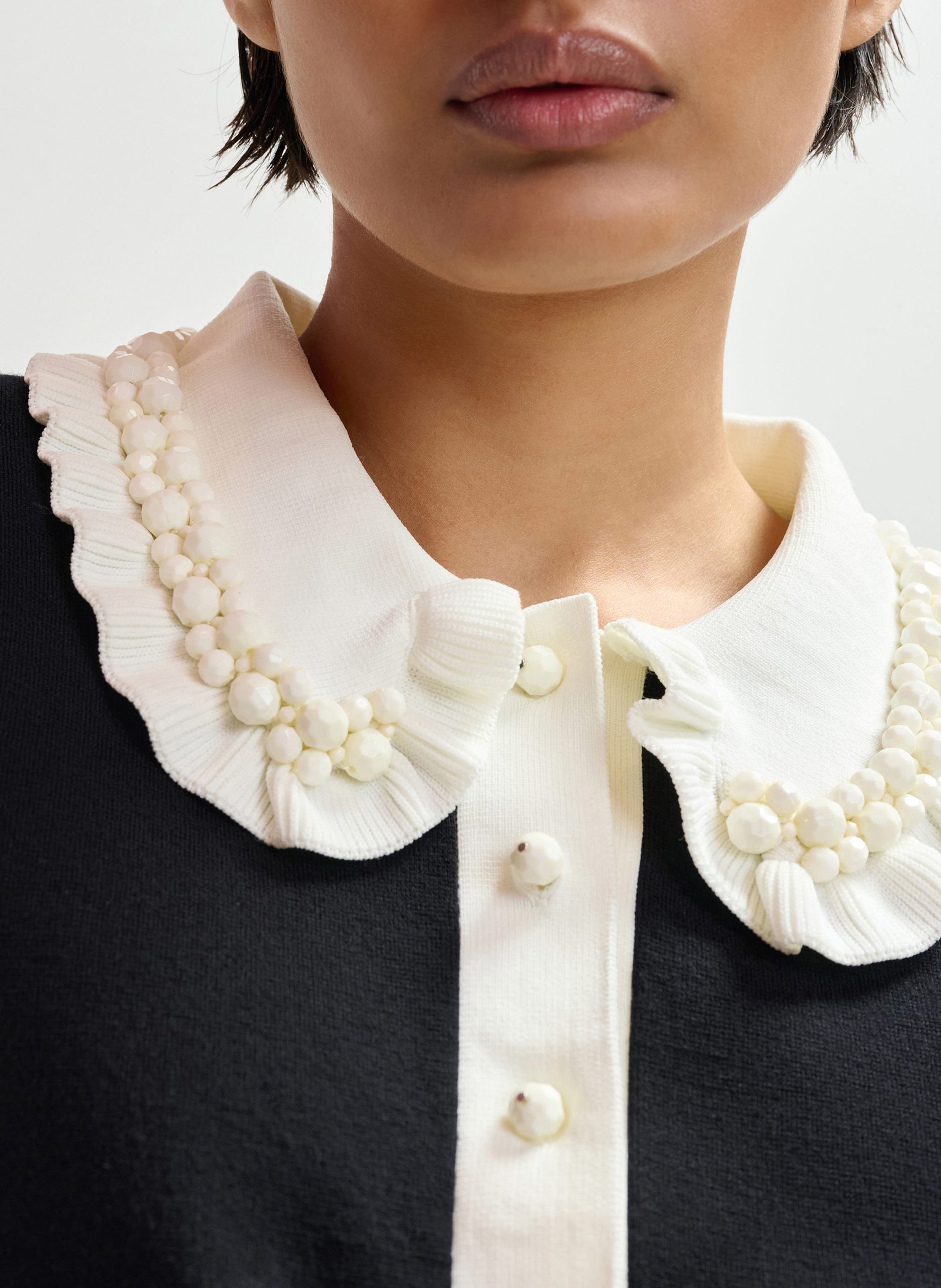 Polo manches courtes uni à volants Jewelry ESSENTIEL ANTWERP Noir