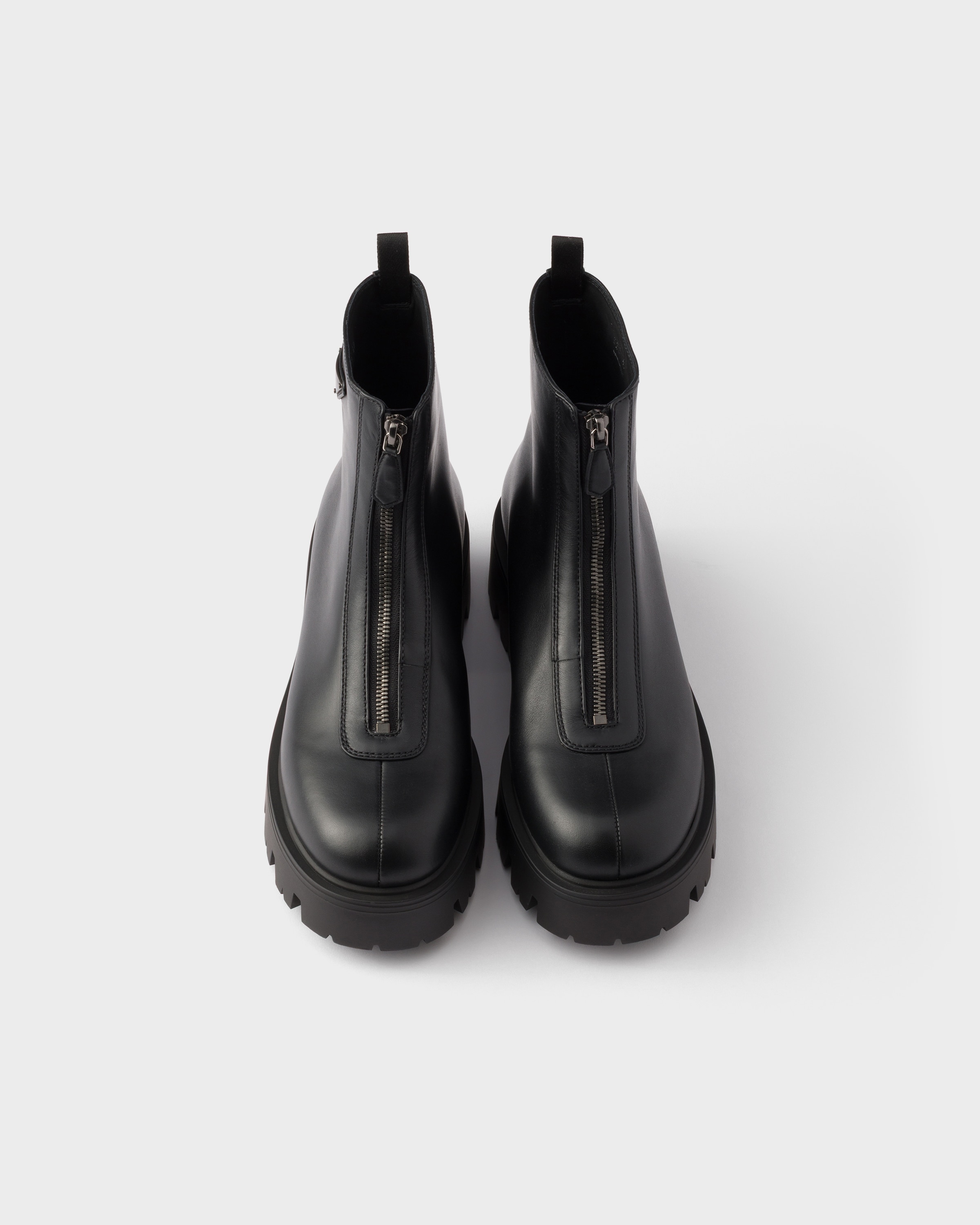 Bottines en cuir avec fermeture à glissière PRADA Noir