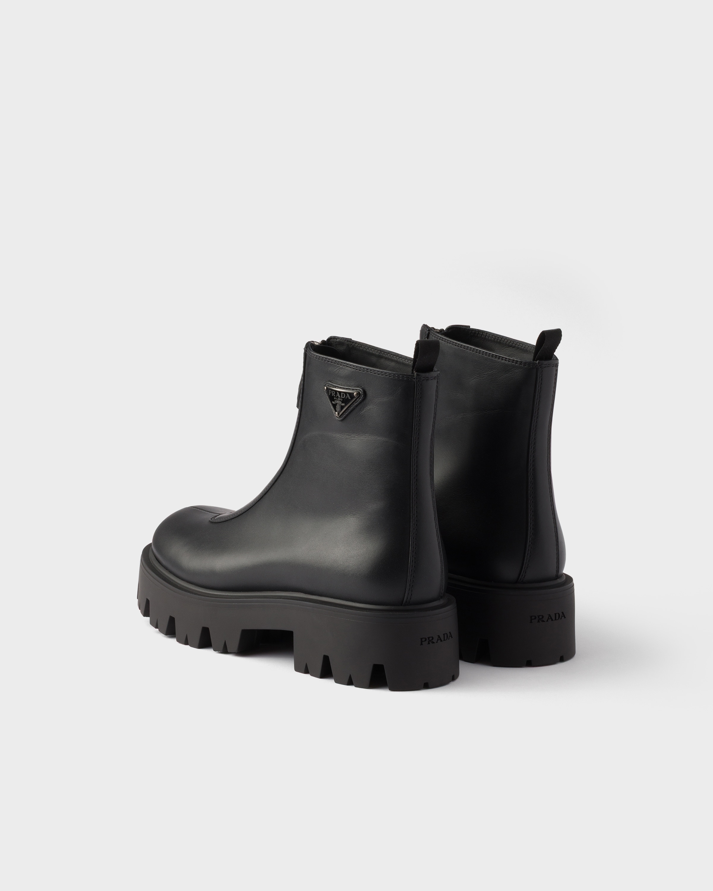 Bottines en cuir avec fermeture à glissière PRADA Noir