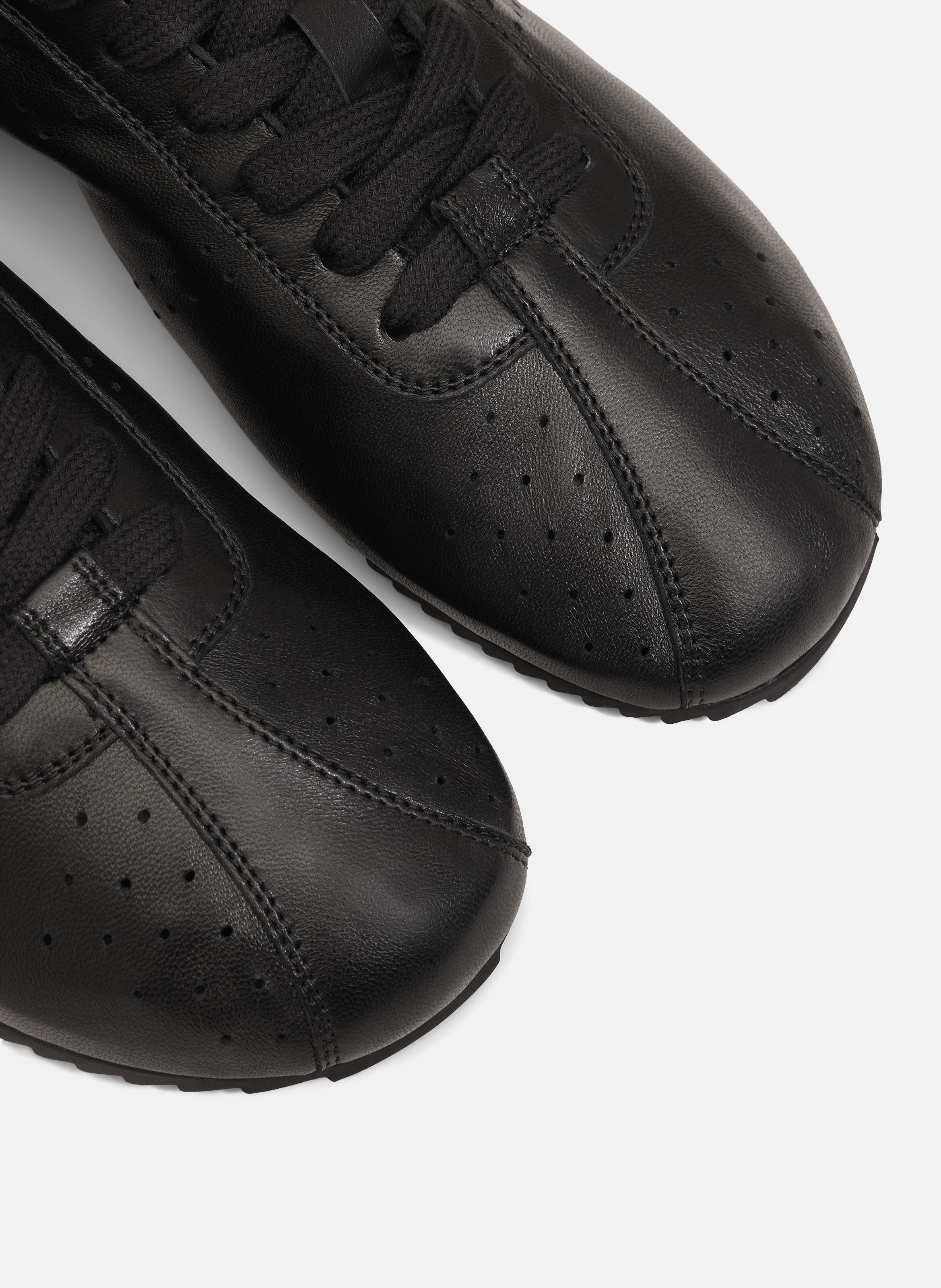 Baskets Soft Basses En Cuir Lisse unisexes AMI PARIS Noir