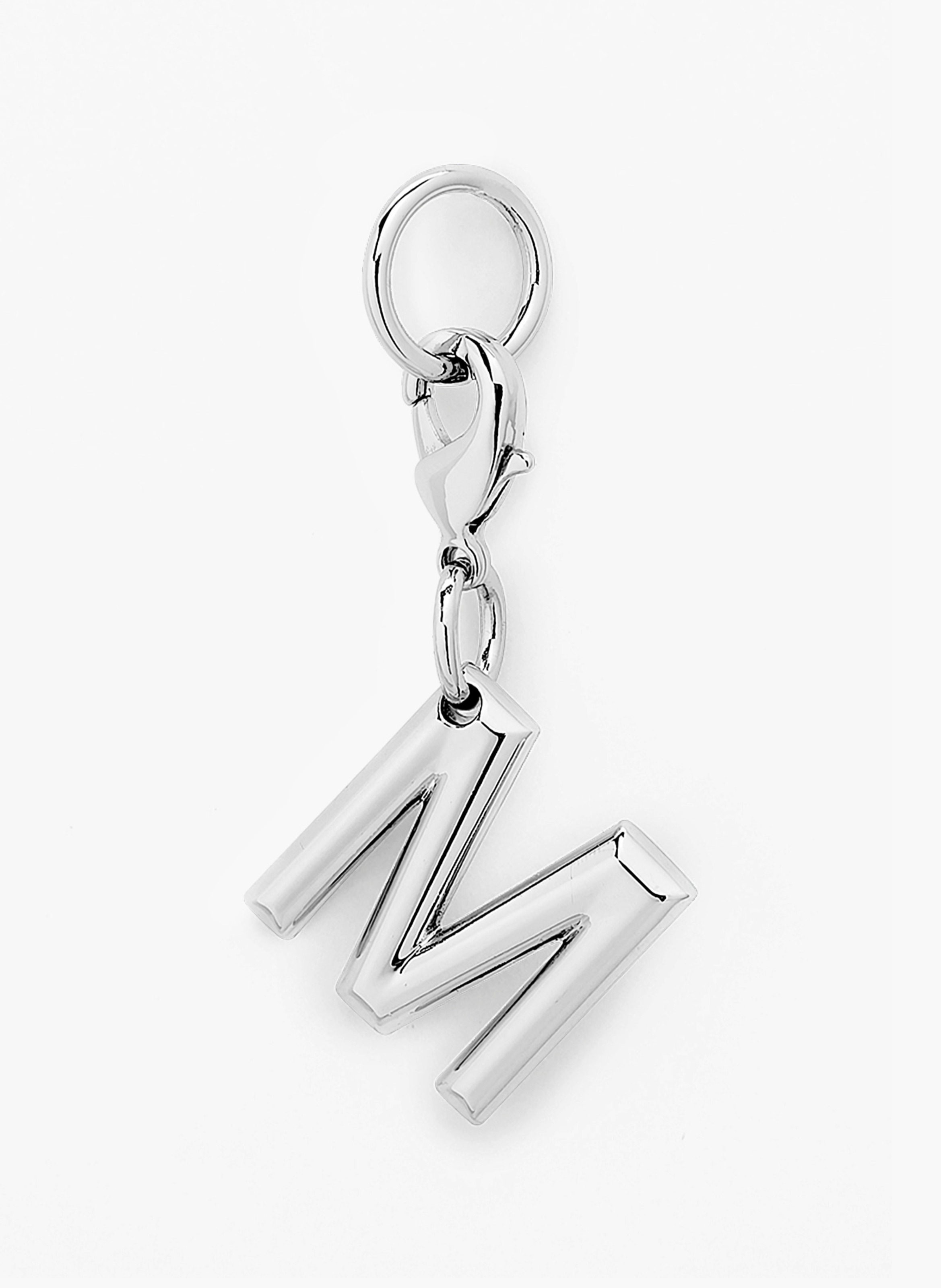 Charme métallique argenté en forme de lettre m par lancel. LANCEL Argent