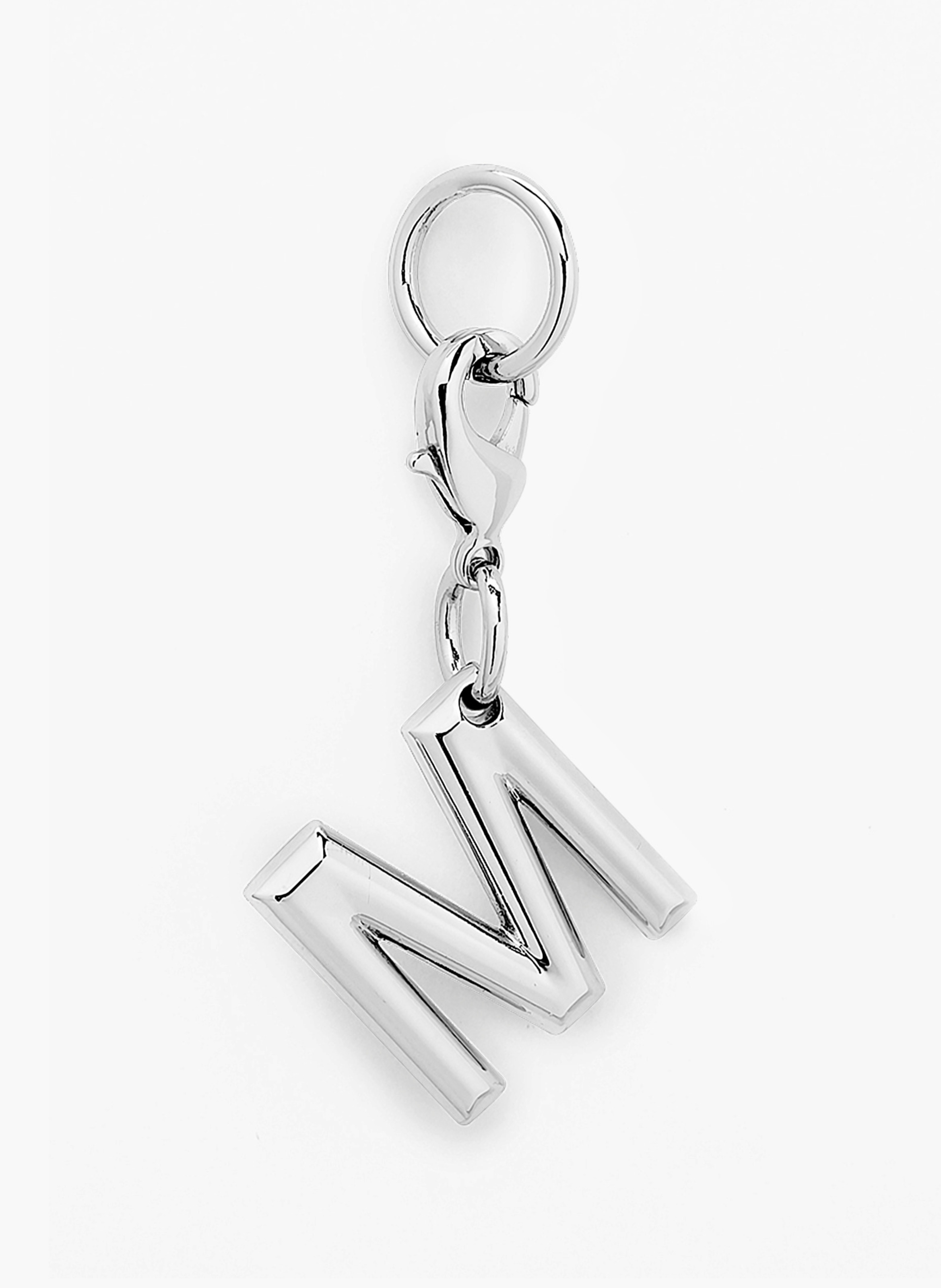 Charme métallique argenté en forme de lettre m par lancel. LANCEL Argent