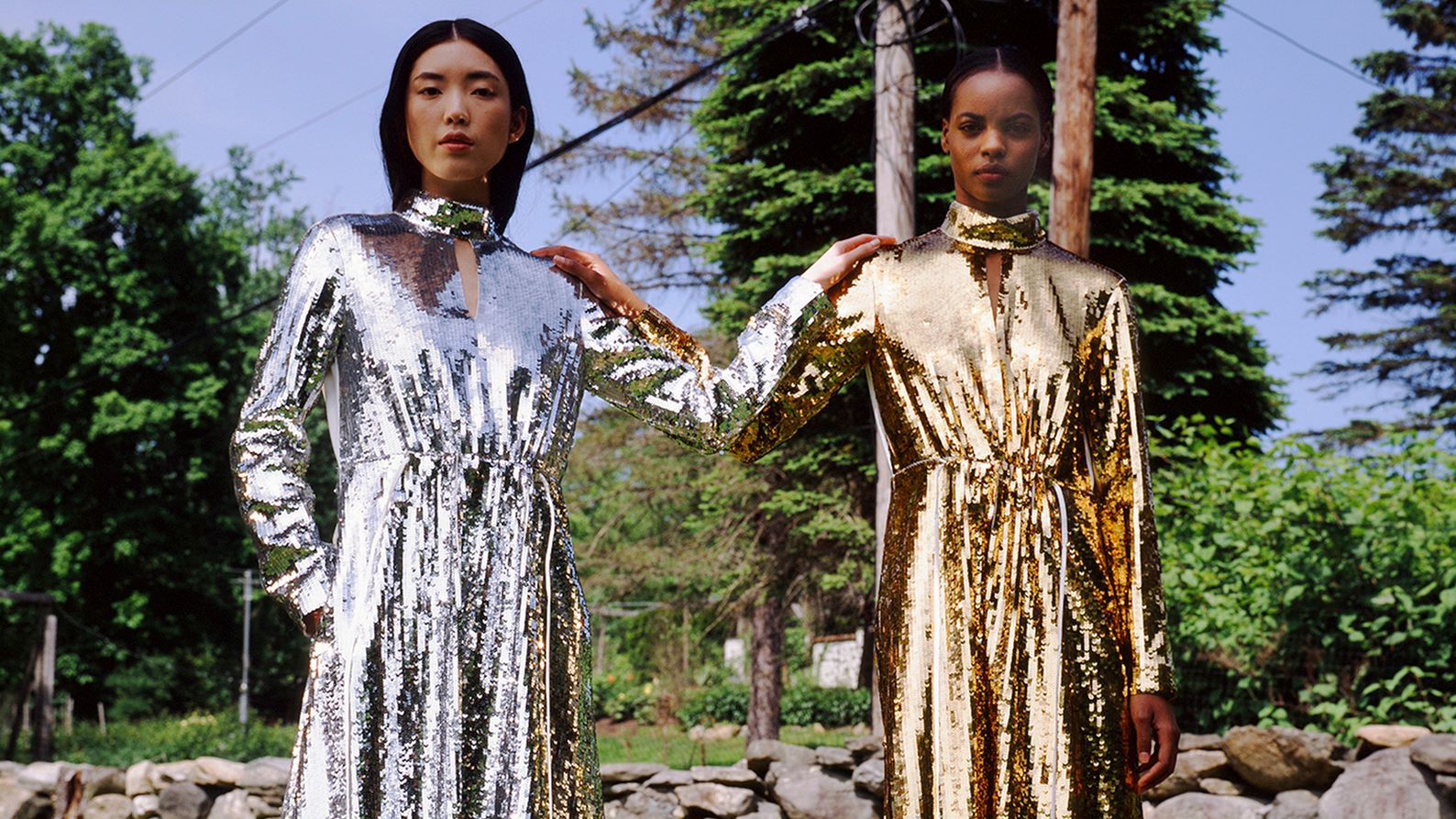 Two models Tibi in sequined dresses 