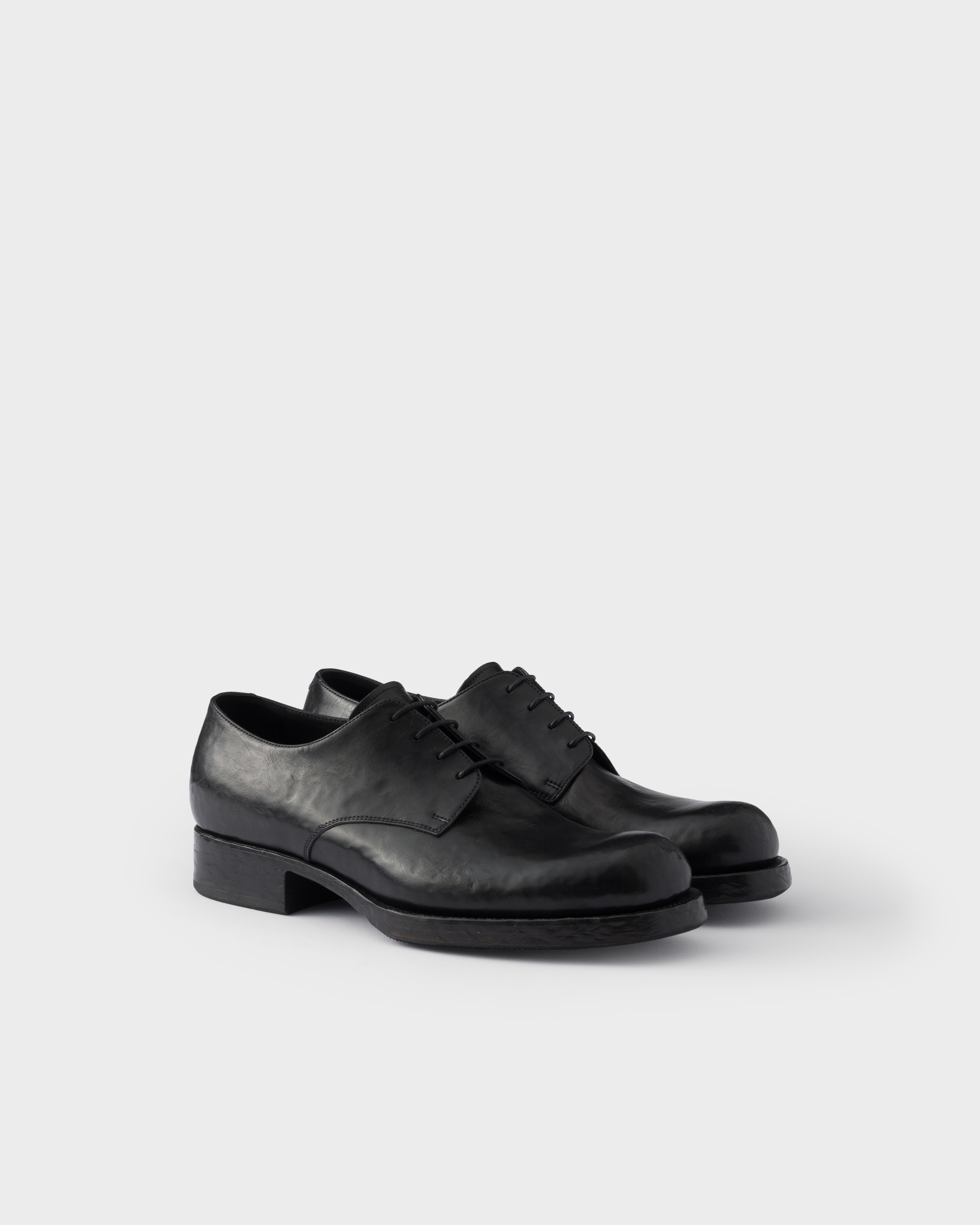 Chaussures à lacets en cuir vieilli PRADA Noir