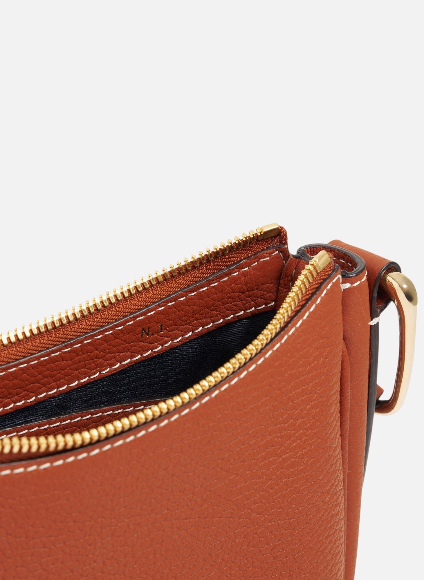 Petit sac bandoulière madeleine en cuir de taurillon grainé LE TANNEUR Marron