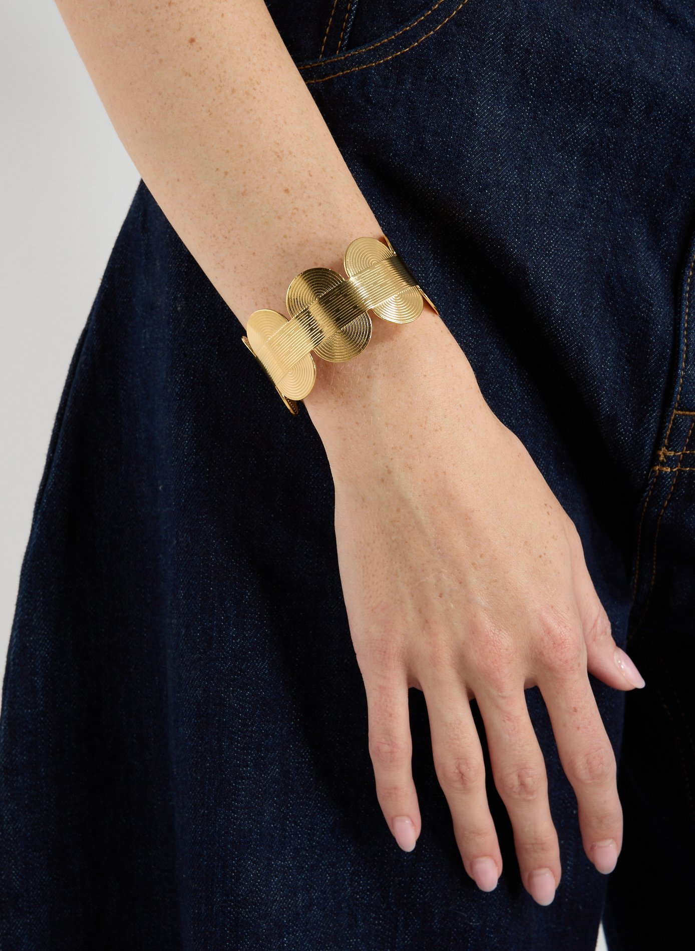 Manchette demi cercle AU PRINTEMPS PARIS Doré