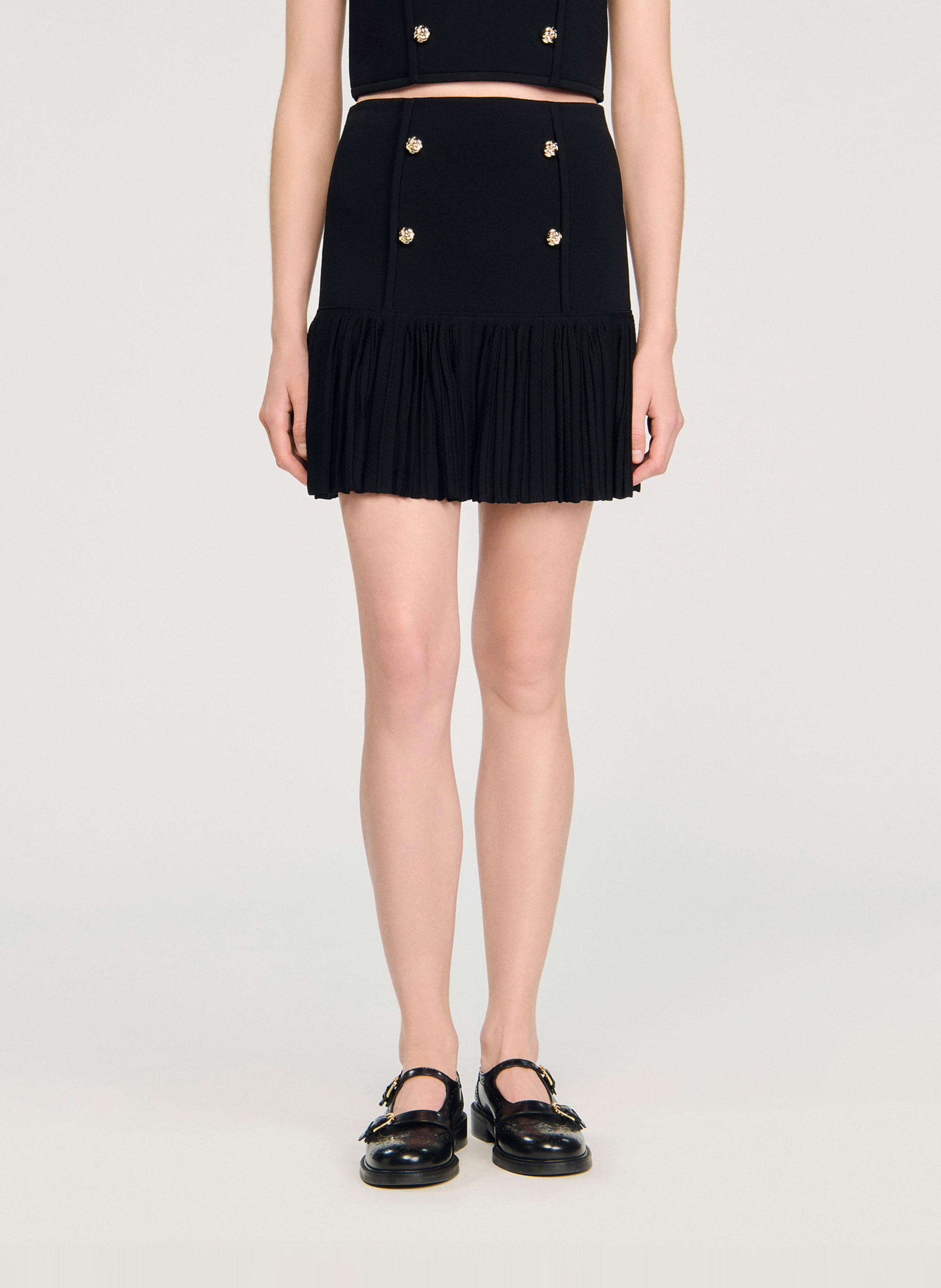 SANDRO Jupe courte plissée en maille Noir