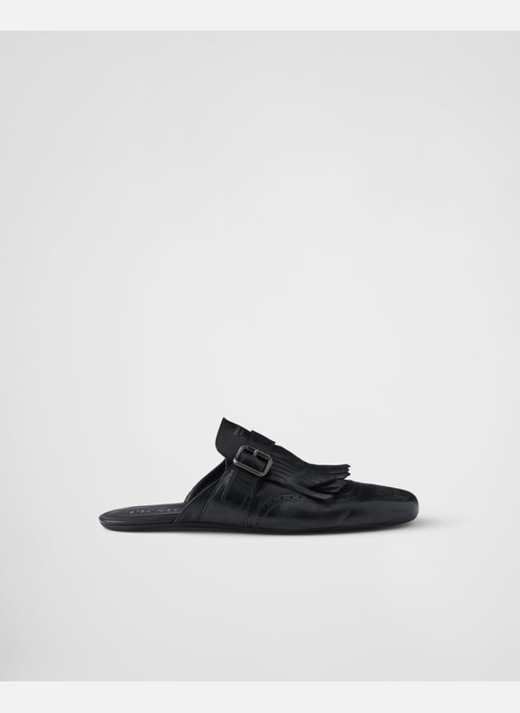 Mules shuffle en cuir à boucle et frange Noir by PRADA PRADA Mules shuffle en cuir à boucle et frange Noir