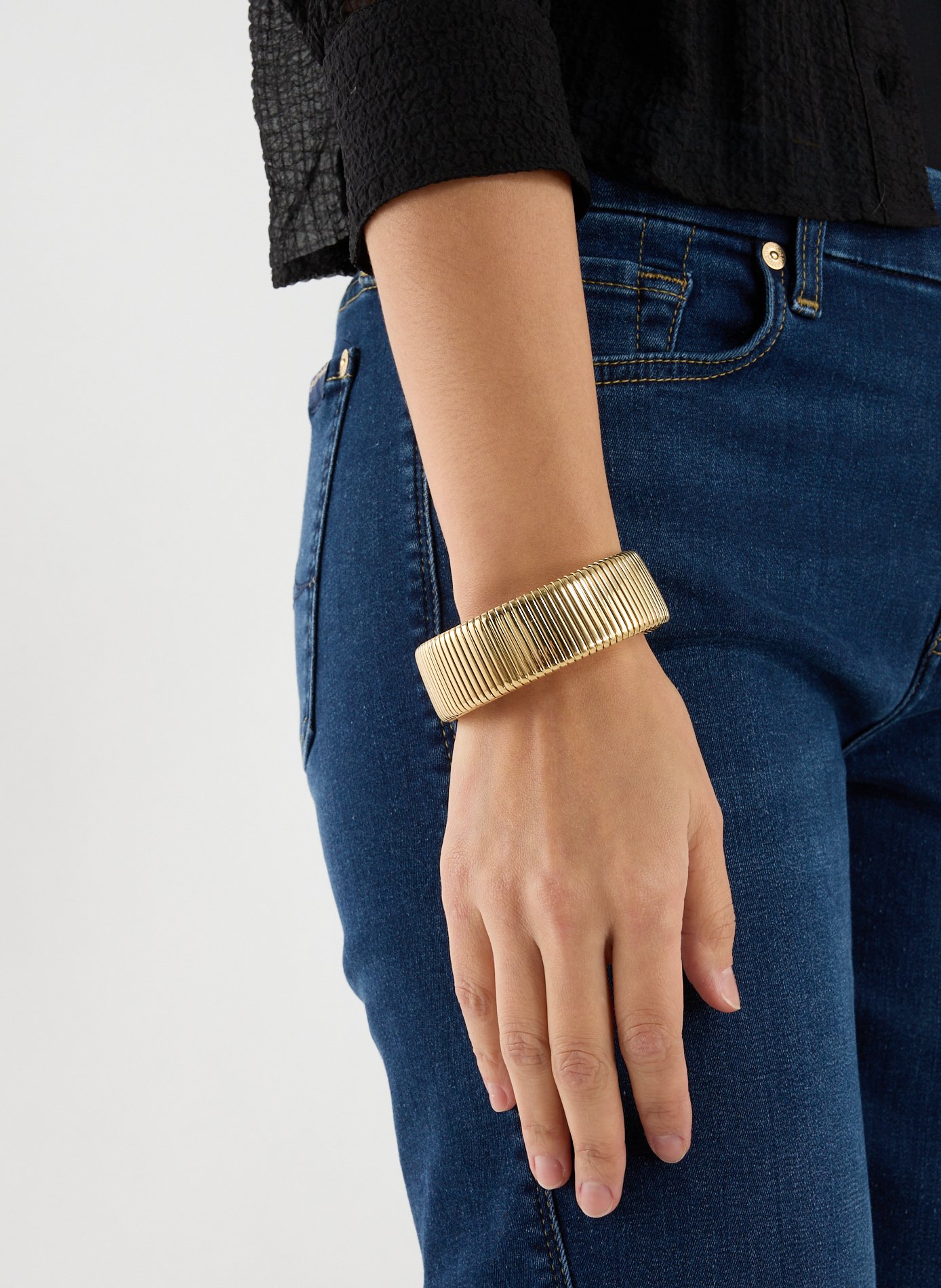 AU PRINTEMPS PARIS Bracelet à rayures Doré