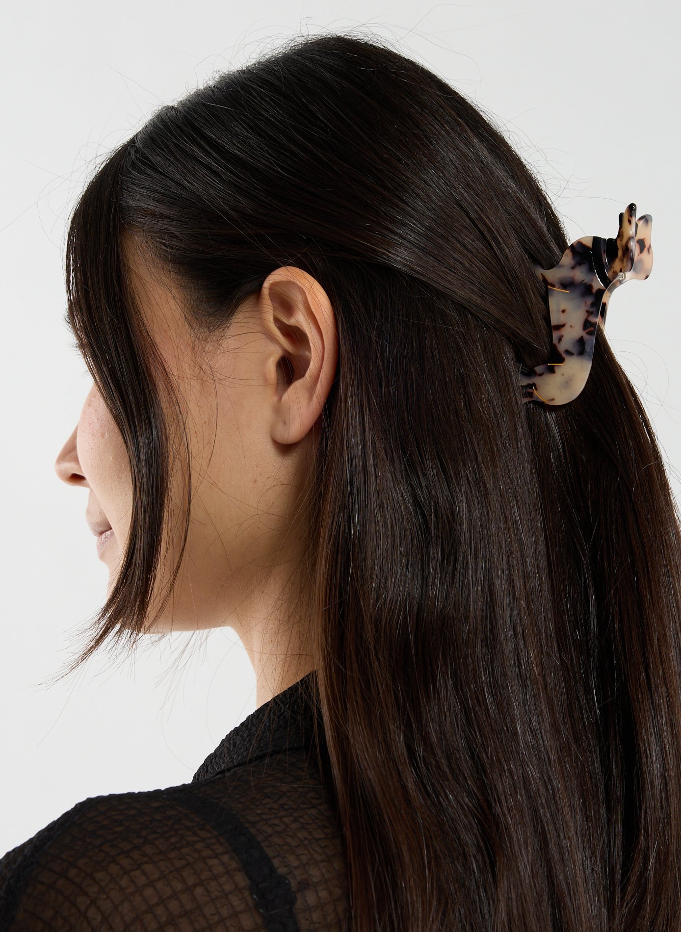 AU PRINTEMPS PARIS Pince à cheveux forme chien Marron