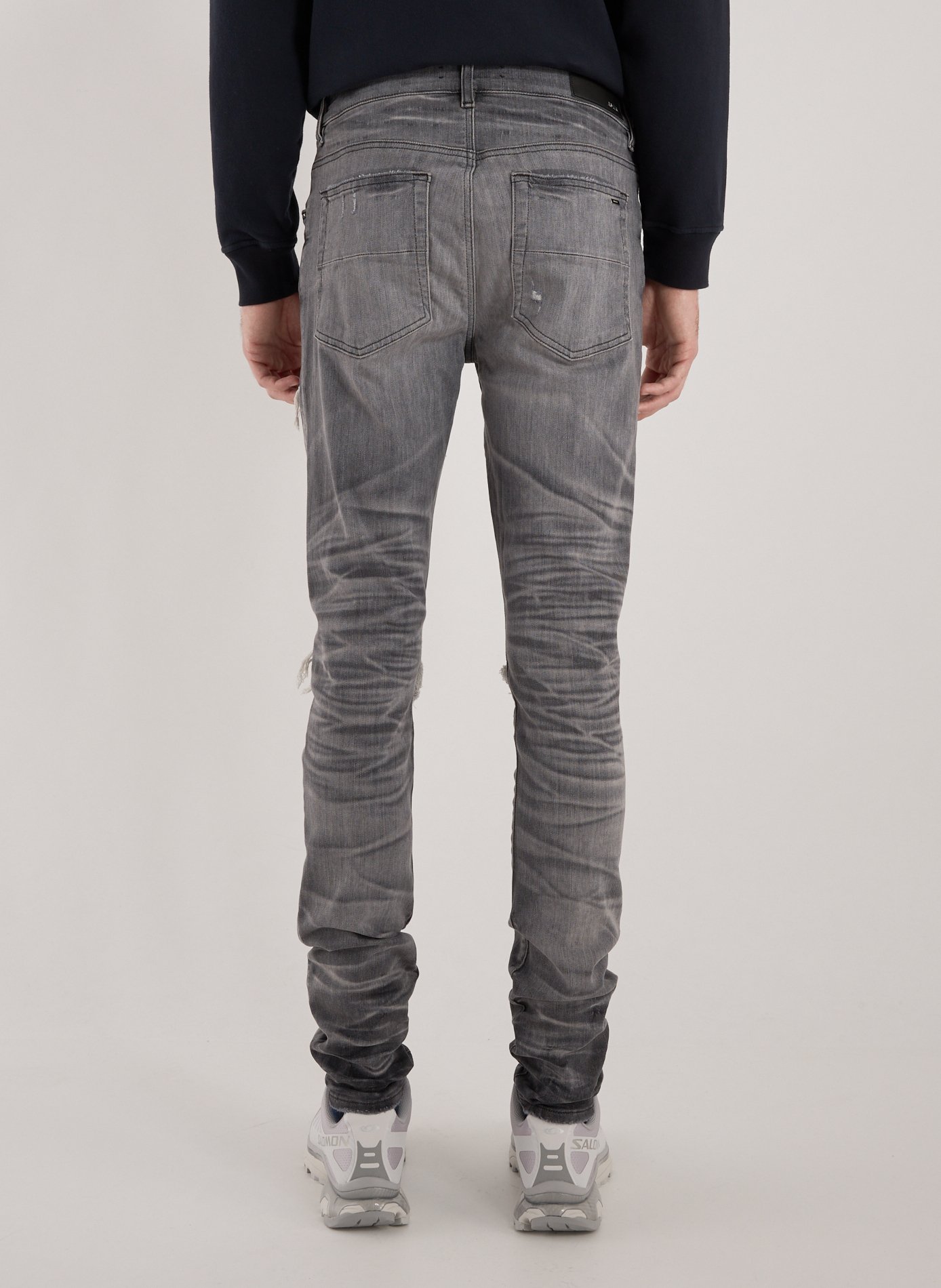 Jeans délavé et déchiré en coton mélangé AMIRI Gris