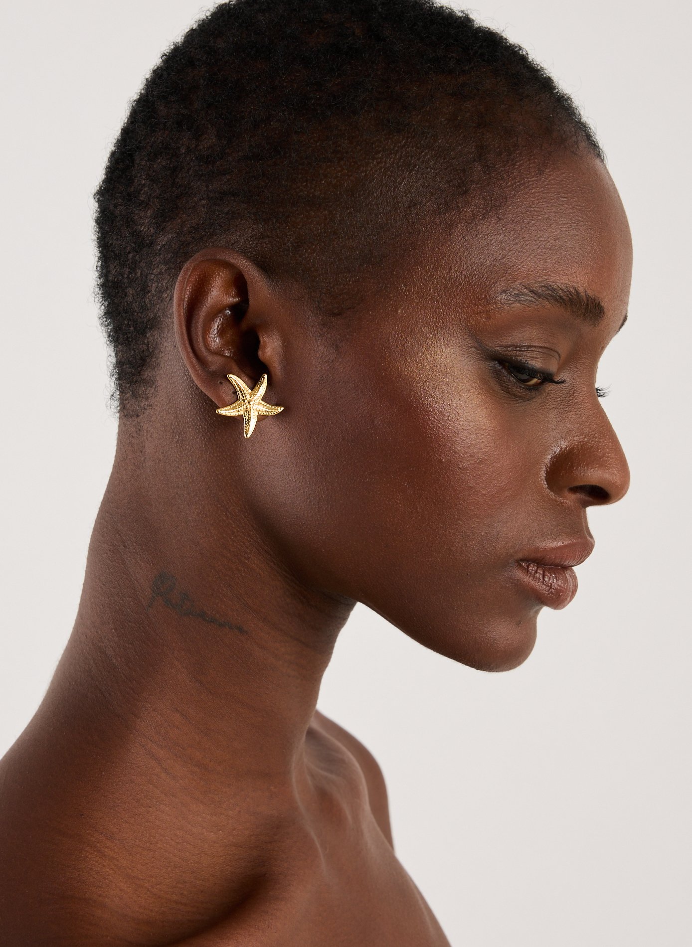 Boucles d&#039;oreille étoile AU PRINTEMPS PARIS Doré