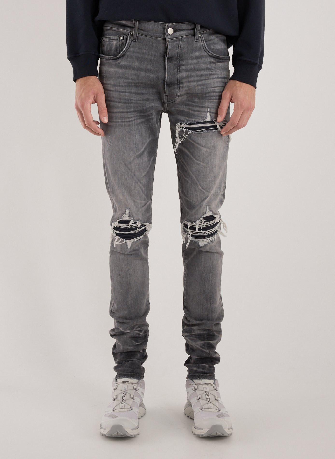 AMIRI Faded and ripped mixed cotton jeans Grey