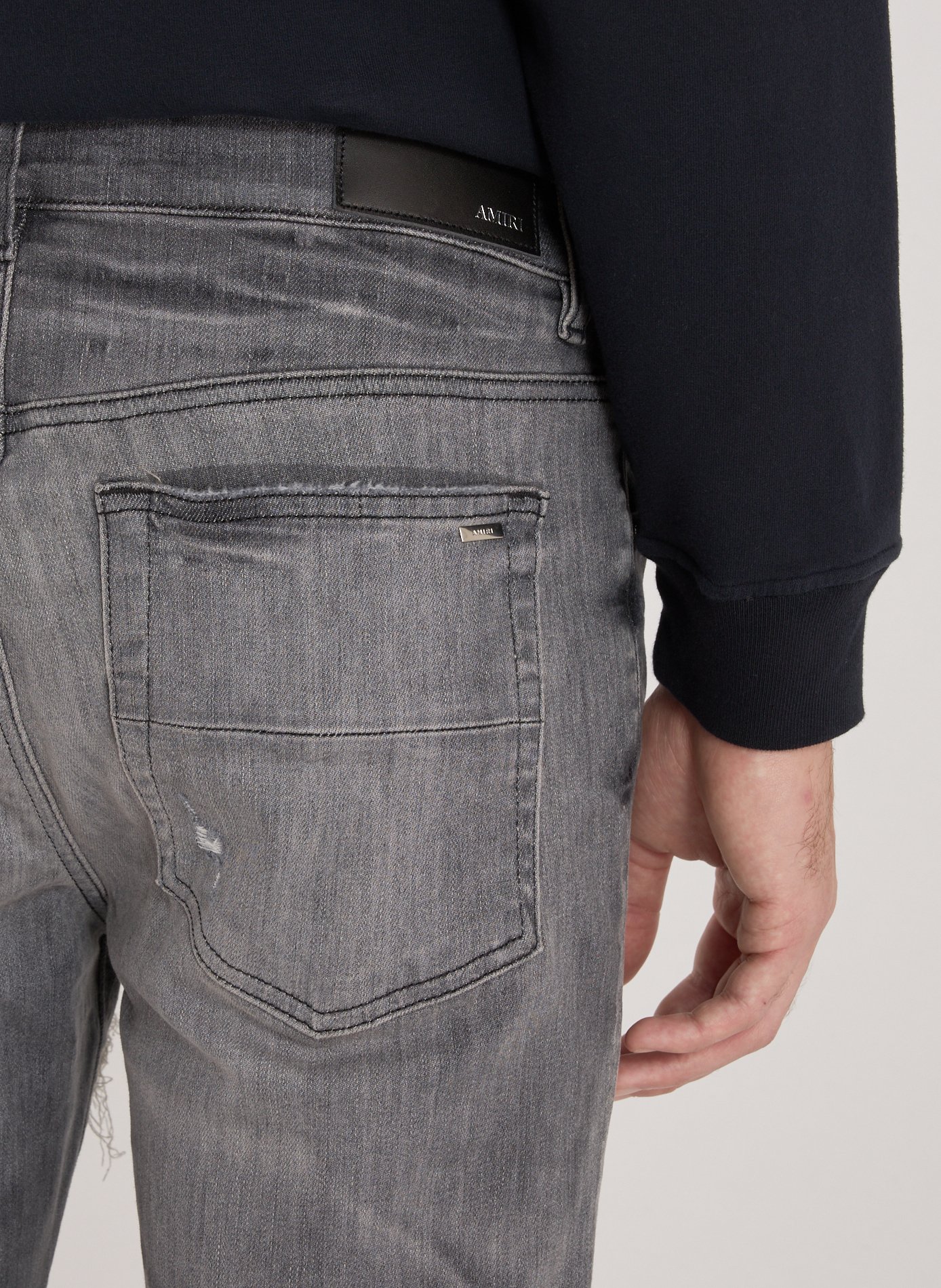 Jeans délavé et déchiré en coton mélangé AMIRI Gris
