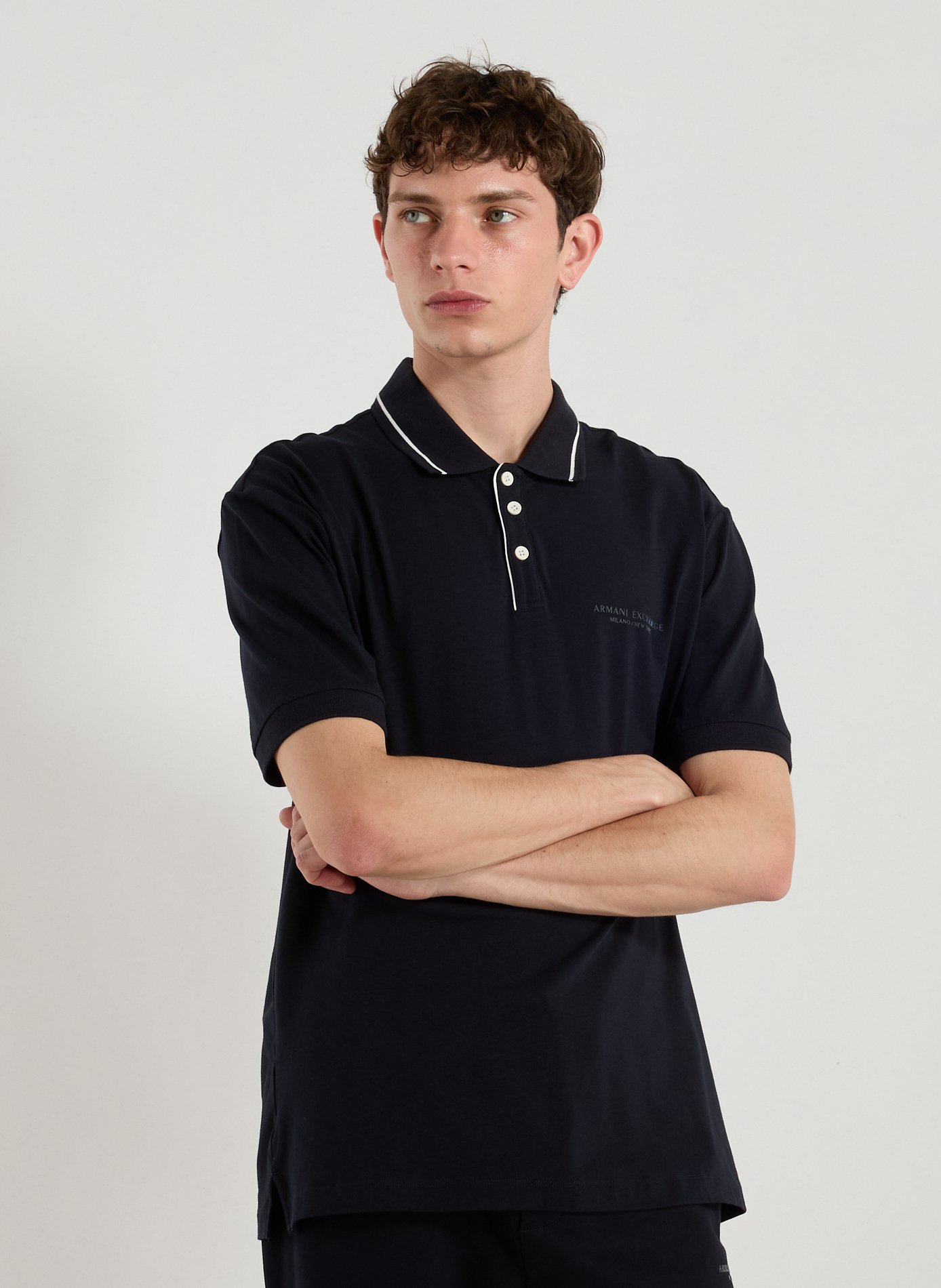 ARMANI EXCHANGE Polo uni en coton mélangé Bleu
