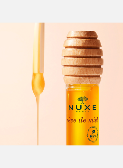 Rêve de Miel® Clear Beautifying Lip Oil in a bottle NUXE
