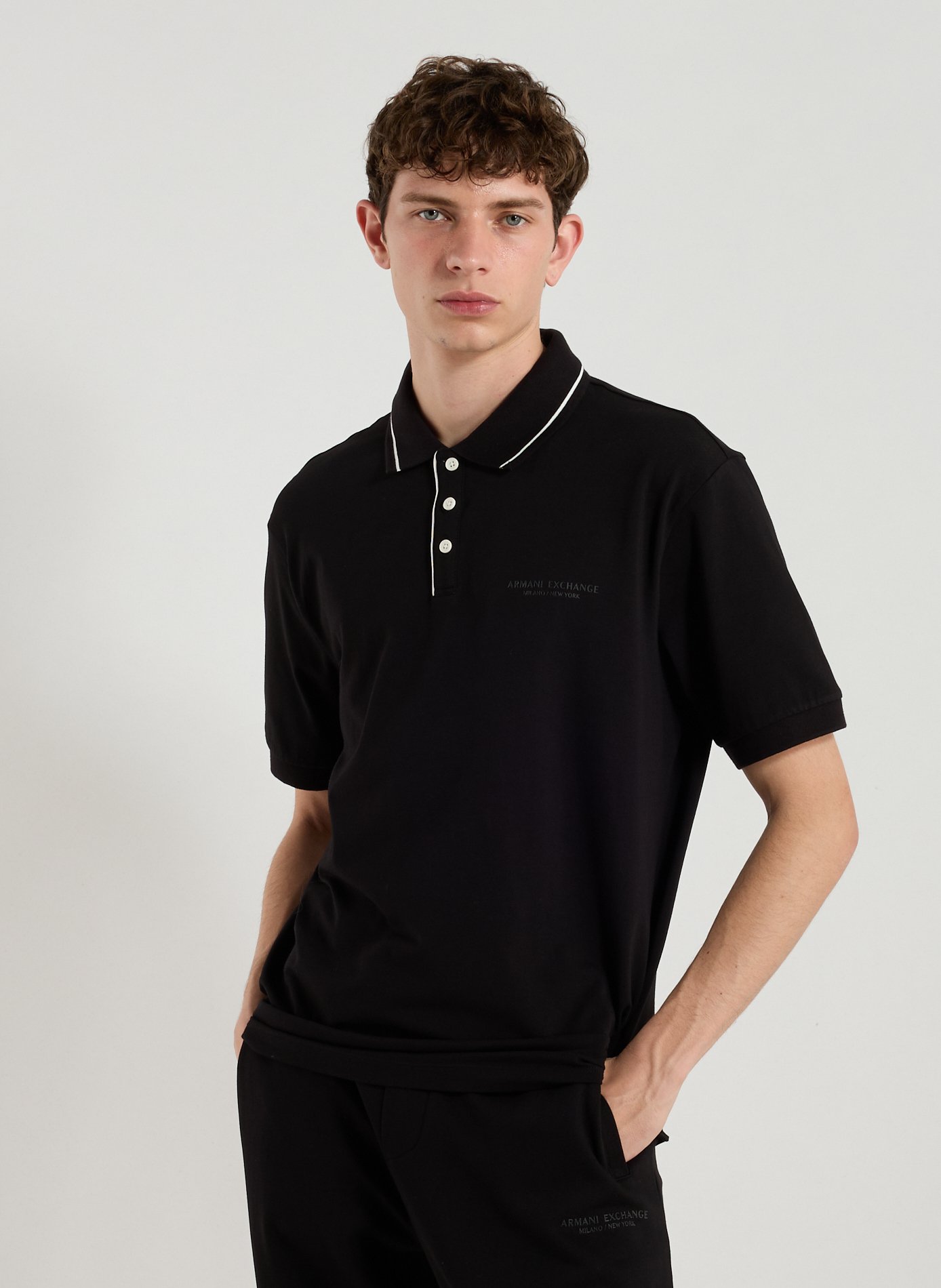 ARMANI EXCHANGE Polo uni en coton mélangé Noir