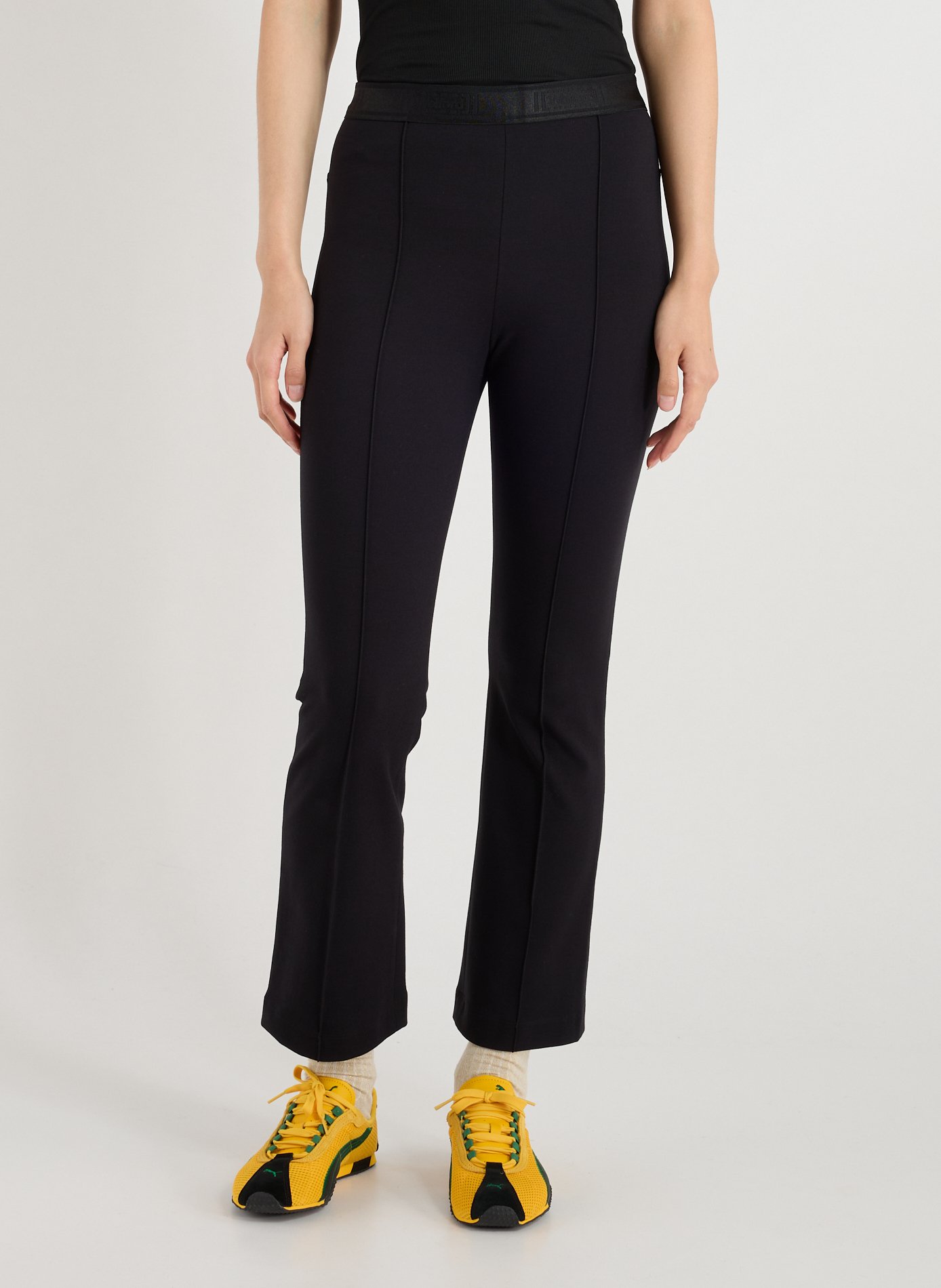 WOLFORD Flared trousers Black