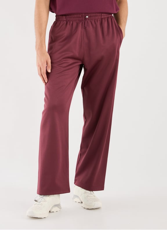 Solid color jogger pants with embroidery. Red by ARTE ANTWERP ARTE ANTWERP Solid color jogger pants with embroidery. Red